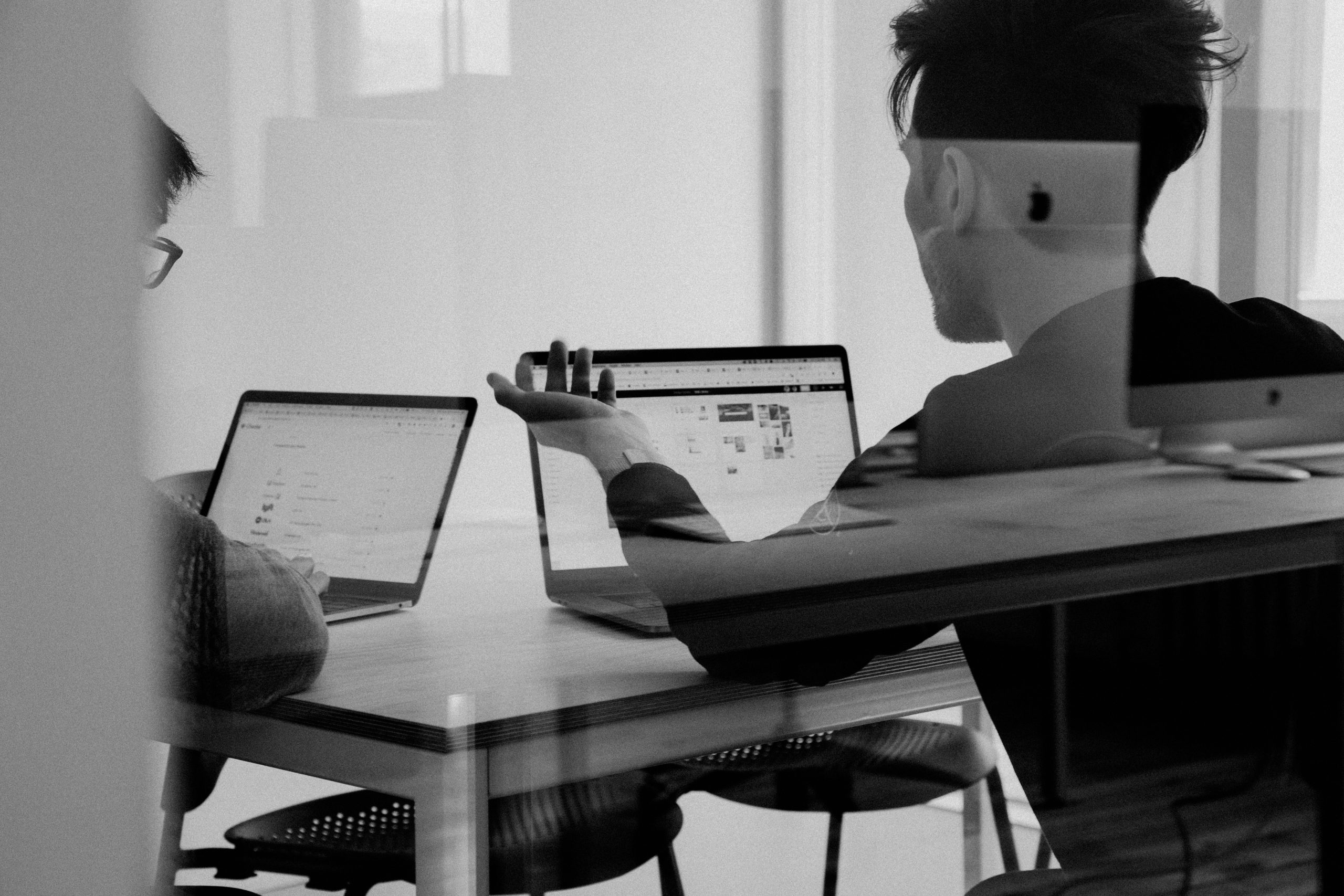 employees around the desk collaborating