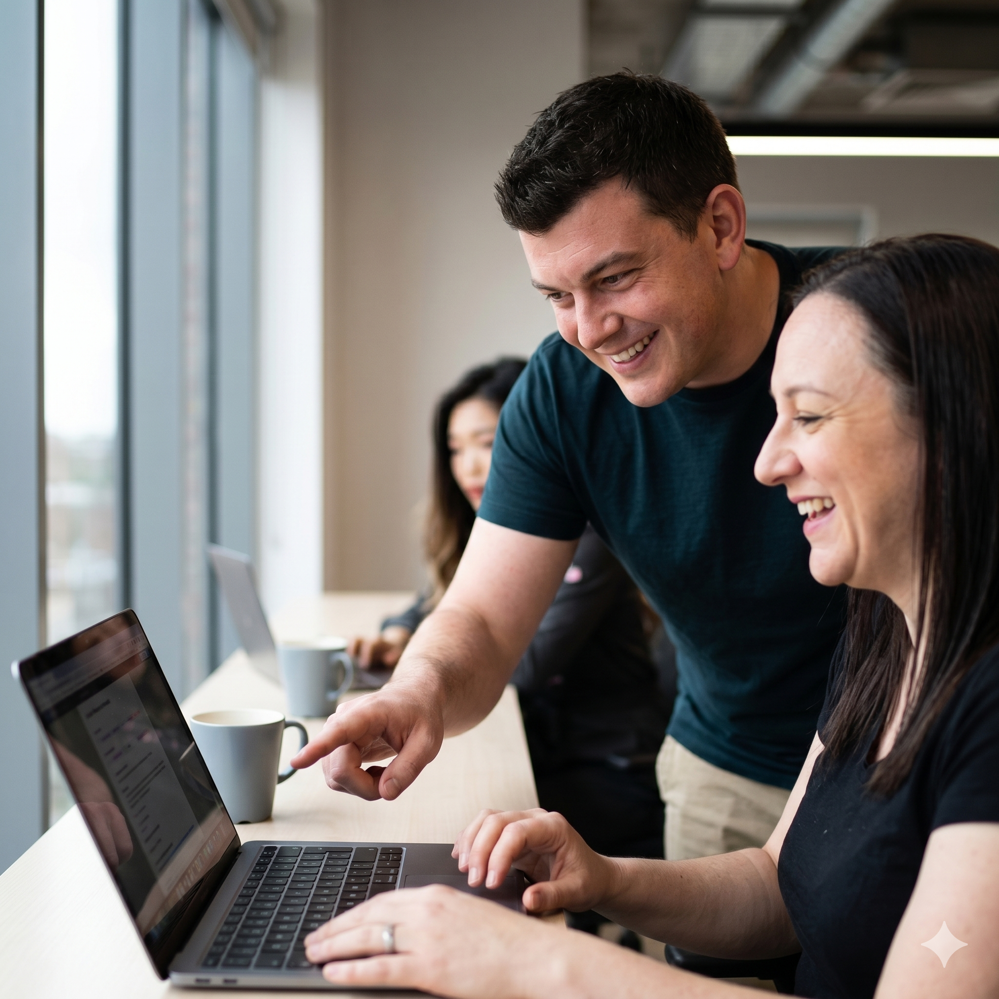 employees around the desk collaborating